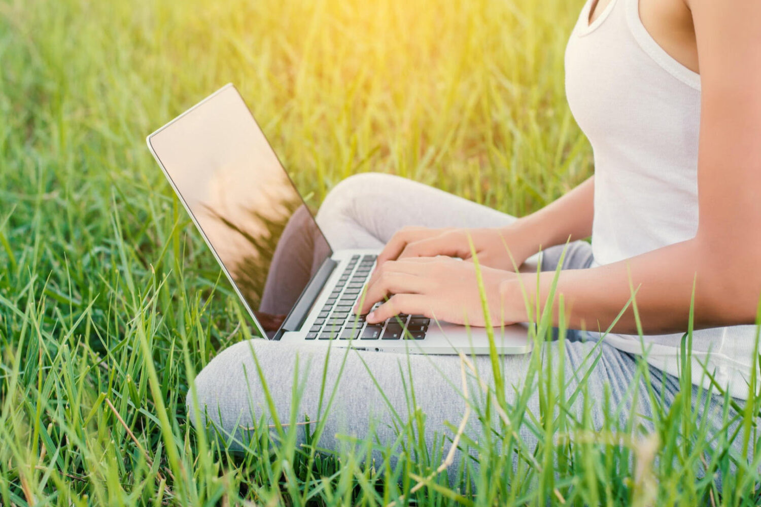 close up woman working with her laptop outdoors