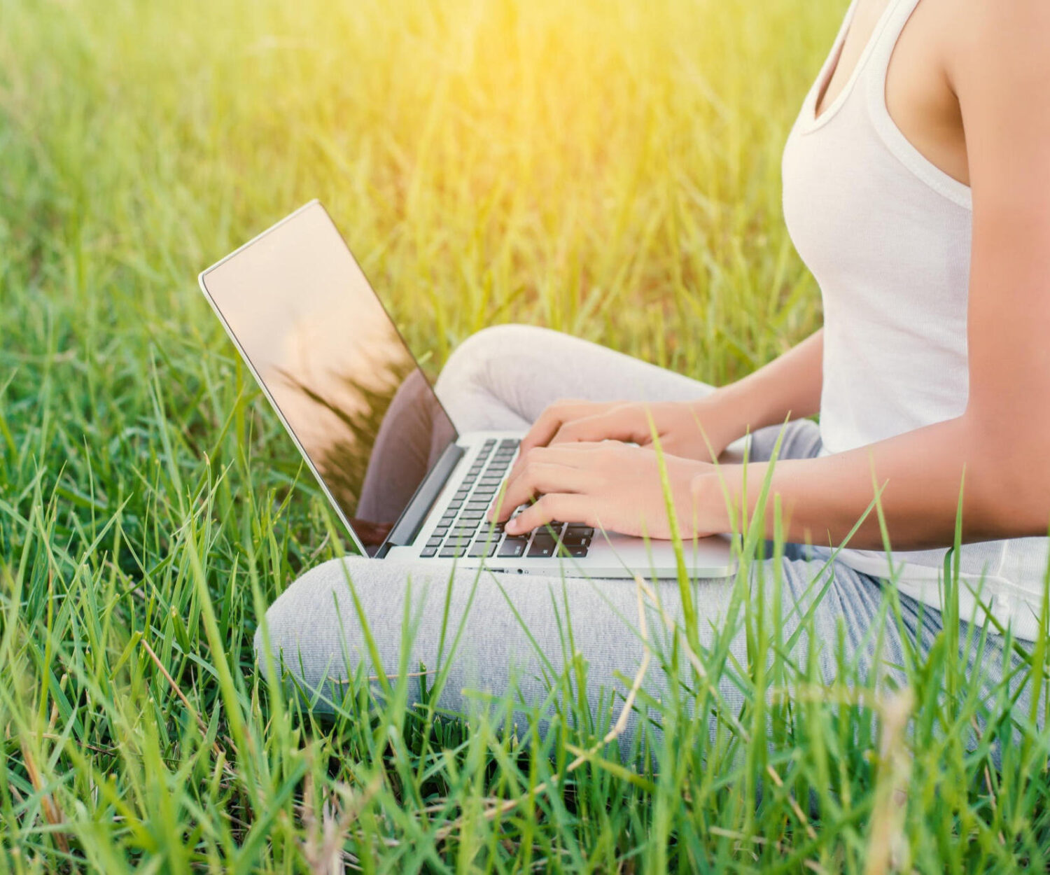 close up woman working with her laptop outdoors